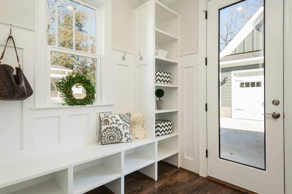 A mudroom with shelves that double as benches
